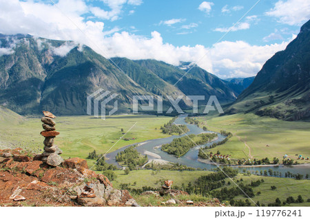 Stone pyramid in river valley Chulyshman. Natural landscape Republic Altai, Russia, summer sunny day. mountain in clouds 119776241