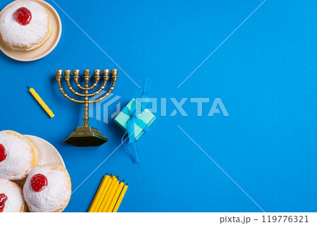 Hanukkah template with Menorah and sufganiyah jelly donuts 119776321