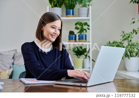 Young female using computer laptop for studying working 119777132