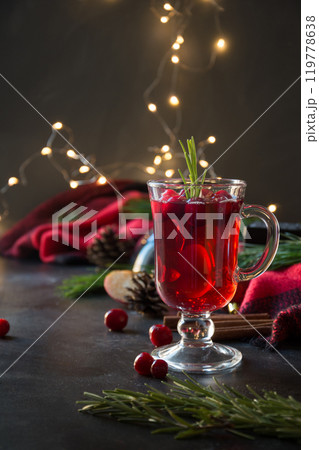 Christmas cranberry and apple mulled wine garnish rosemary and fir branches on black. Close up. Xmas drink. 119778638