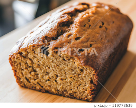 Close-up of a homemade loaf of pumpkin bread with a golden crust 119778639