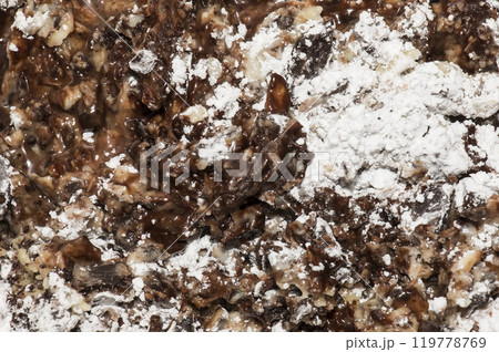 Cocoa butter and cocoa liquor melt, top view, texture. Basic ingredients for making chocolate at home. Close-up of chopped food, top view. Cocoa butter and cocoa liquor melt, top view, texture. Basic ingredients for making chocolate at home. Close-up of chopped food, top view. 119778769