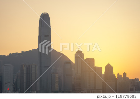 HONG KONG, CHINA - November 27, 2023: Hong Kong downtown skyline across Victoria harbor at sunset time, Hong Kong, China. Golden hour. HONG KONG, CHINA - November 27, 2023: Hong Kong downtown skyline across Victoria harbor at sunset time, Hong Kong, China. Golden hour. 119779685