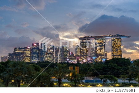 SINGAPORE, SINGAPORE - August 26, 2023: Panorama view of Skyline of Singapore Marina Bay at night with Marina Bay sands, Art Science museum and Flyer. 119779691