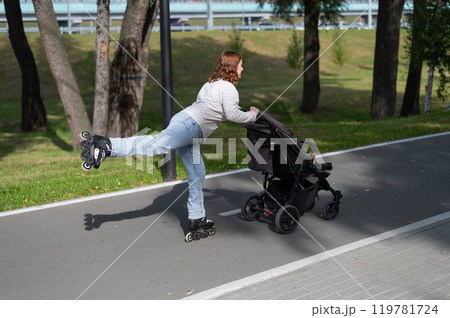 Caucasian woman roller skating with her toddler son in a stroller. Caucasian woman roller skating with her toddler son in a stroller. 119781724