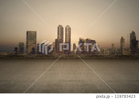 Empty rooftop balcony with view of modern building skyscrapers and futuristic architecture with sunset scene Empty rooftop balcony with view of modern building skyscrapers and futuristic architecture with sunset scene 119783423