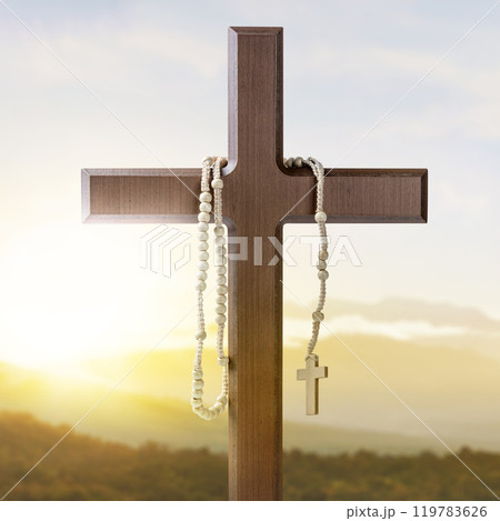 Religion christianity cross and rosary beads with sunlight background. Symbol of faith and worship in God Religion christianity cross and rosary beads with sunlight background. Symbol of faith and worship in God 119783626