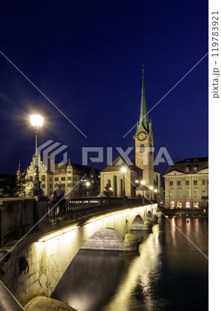sunset scenic view of historic Zurich city center with famous Fraumunster and river Limmat at Lake Zurich,Switzerland 119783921