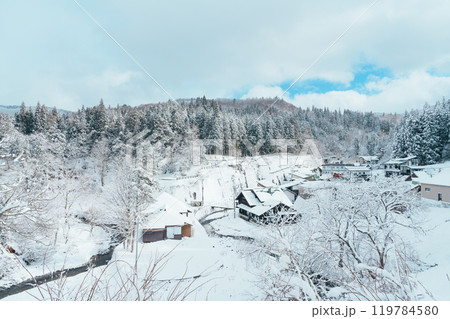 Beautiful view of Ginzan Onsen village with snow fall in winter season is most famous Japanese Hot Spring in Yamagata, Japan. Beautiful view of Ginzan Onsen village with snow fall in winter season is most famous Japanese Hot Spring in Yamagata, Japan. 119784580