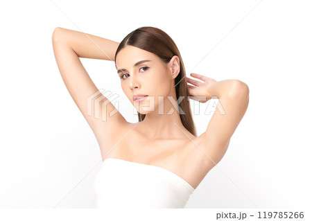 Beautiful Young Asian woman lifting hands up to show off clean and hygienic armpits or underarms on white background, Smooth armpit cleanliness and protection concept 119785266