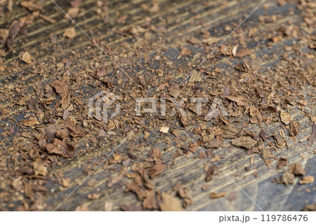 a broken and colored cigar made of high-quality tobacco leaves a broken and colored cigar made of high-quality tobacco leaves 119786476