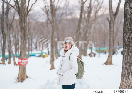 Woman tourist with snow in winter season at Zao fox village, traveler sightseeing Miyagi prefecture. landmark and popular for attraction near Sendai, Tohoku, Japan. Travel and Vacation 119790076