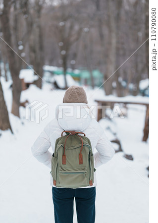 Woman tourist with snow in winter season at Zao fox village, traveler sightseeing Miyagi prefecture. landmark and popular for attraction near Sendai, Tohoku, Japan. Travel and Vacation 119790080