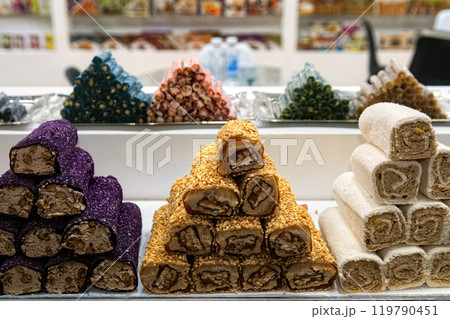 Various Turkish sweets in confectionery shop window. Traditional Turkish Delight (Rahat Lokum) with nuts and sweets. Various Turkish sweets in confectionery shop window. Traditional Turkish Delight (Rahat Lokum) with nuts and sweets. 119790451
