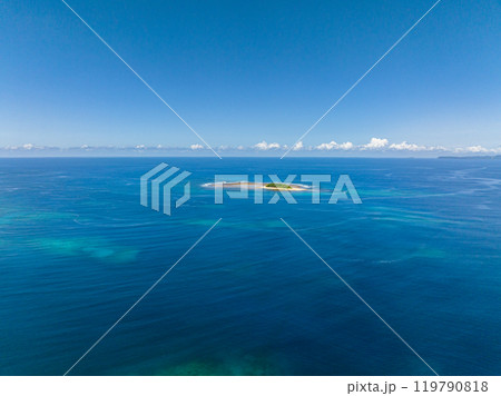 Aerial top survey of Stunning Islet in the middle of deep blue sea. Jobo Island. Mindanao, Philippines. Aerial top survey of Stunning Islet in the middle of deep blue sea. Jobo Island. Mindanao, Philippines. 119790818