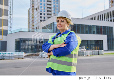 Portrait of woman builder engineer supervisor at outdoor construction Portrait of woman builder engineer supervisor at outdoor construction 119791535