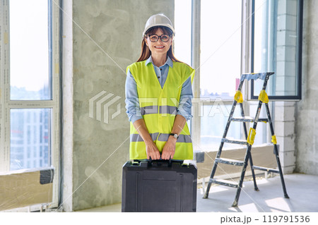 Portrait of female industrial worker builder engineer supervisor at construction 119791536