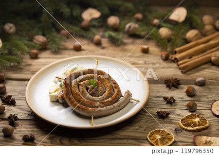 Christmas wine sausage served with potato salad 119796350
