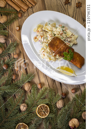 Christmas fried carp with potato salad 119796351