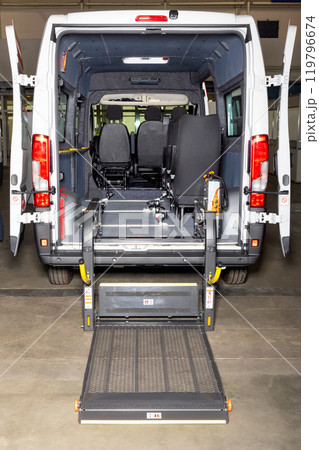 Wheelchair lift equipped van offering accessible transportation. Wheelchair lift equipped van offering accessible transportation. 119796674