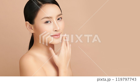 Beautiful young asian woman with clean fresh skin on beige background, Face care, Facial treatment, Cosmetology, beauty and spa, Asian women portrait. 119797743