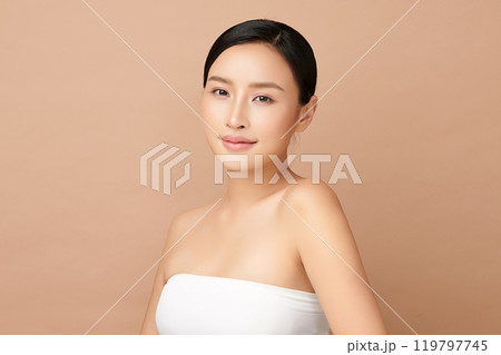 Beautiful young asian woman with clean fresh skin on beige background, Face care, Facial treatment, Cosmetology, beauty and spa, Asian women portrait. Beautiful young asian woman with clean fresh skin on beige background, Face care, Facial treatment, Cosmetology, beauty and spa, Asian women portrait. 119797745