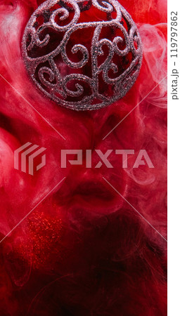 Xmas bauble. Color mist. Defocused shiny glitter red swirl texture sphere vapor floating ink water flow Christmas decoration abstract background. 119797862