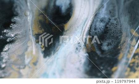 Paint spill. Liquid art. Defocused blue golden black color sparkling particle texture fluid ink mix wave abstract background. 119797944