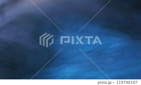 Sparkling texture. Glitter particles. Defocused blue pigment flow wave deep sea color mix decorative abstract art background. 119798107