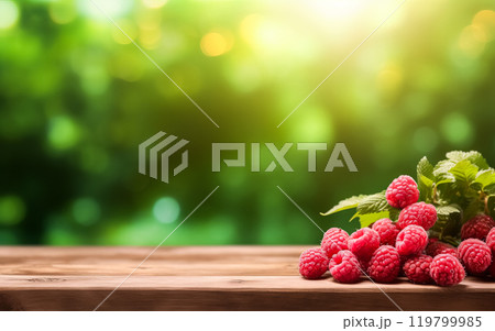Fresh raspberries arranged on a wooden table in a garden Fresh raspberries arranged on a wooden table in a garden 119799985