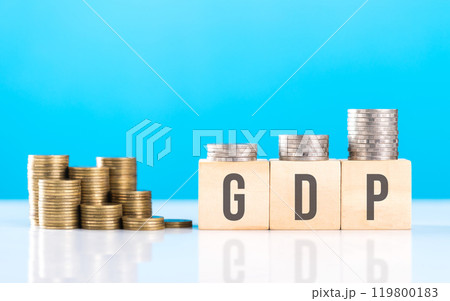 Wooden block labeled 'GDP' alongside a stack of coins. Symbolizes economic growth, emphasizing the significance of Gross Domestic Product in assessing financial progress and national prosperity Wooden block labeled 'GDP' alongside a stack of coins. Symbolizes economic growth, emphasizing the significance of Gross Domestic Product in assessing financial progress and national prosperity 119800183
