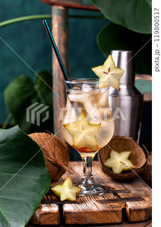 Exotic tropical cocktail with star fruit 119800517