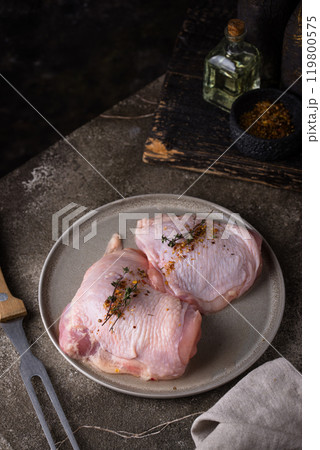 Marinated chicken breasts on plate 119800575
