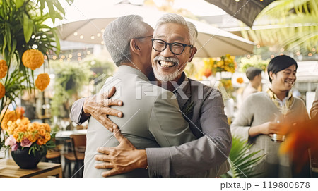 an adult son tenderly hugs his father an adult son tenderly hugs his father 119800878