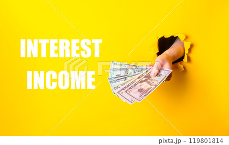 A person is holding a bunch of money A person is holding a bunch of money 119801814