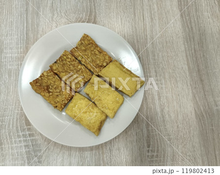 A plate of fried tempeh and tofu, a popular Indonesian dish. 119802413