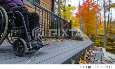 A smooth, step-free outdoor deck allows wheelchair users to comfortably enjoy activities, fostering inclusivity. 119802631