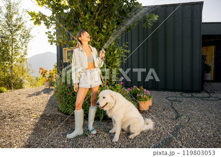 Morning Watering with a Furry Friend Morning Watering with a Furry Friend 119803053
