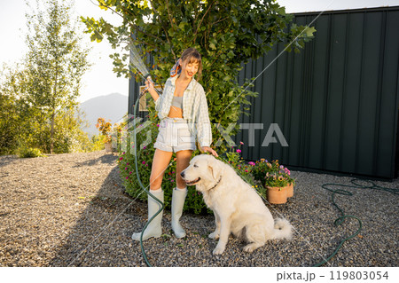 Morning Watering with a Furry Friend 119803054