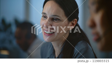 Diverse female hotline operators work in call center office 119803315