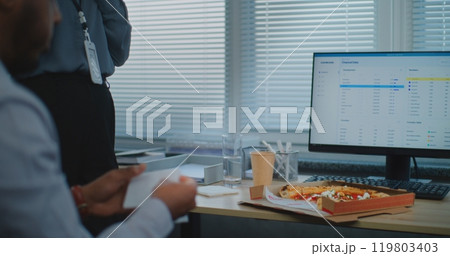 Team of diverse technical customer support specialists talk, eat pizza during break Team of diverse technical customer support specialists talk, eat pizza during break 119803403