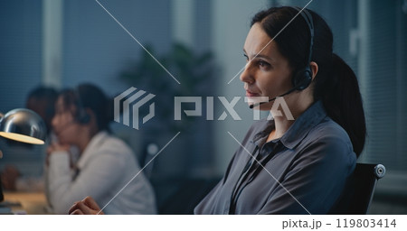 Close up of Caucasian female crisis hotline worker providing psychological help Close up of Caucasian female crisis hotline worker providing psychological help 119803414