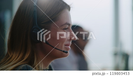 Close up of young technical customer support specialist in headset providing online help 119803453