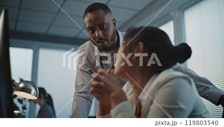 African American employee supports Asian female helpdesk specialist 119803540