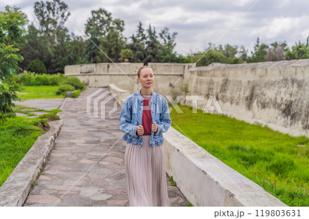Female tourist exploring the Loreto Fort Museum in Puebla, Mexico. Cultural heritage, history, and travel exploration concept Female tourist exploring the Loreto Fort Museum in Puebla, Mexico. Cultural heritage, history, and travel exploration concept 119803631