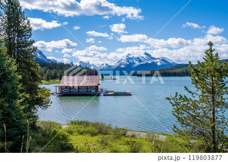 The historic Maligne Lake Boat House. Maligne Lake summer scenery reflected on the water. Jasper National Park, Alberta, Canada. Canadian Rockies. The historic Maligne Lake Boat House. Maligne Lake summer scenery reflected on the water. Jasper National Park, Alberta, Canada. Canadian Rockies. 119803877