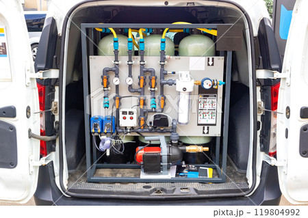 Portable water filtration system in van, showcasing industrial design and functionality of filtration equipment, water purification, technology concept Portable water filtration system in van, showcasing industrial design and functionality of filtration equipment, water purification, technology concept 119804992