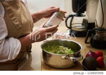 Home cooking with fresh ingredients in a cozy kitchen 119805998