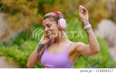 Discover the Joy of Enjoying Music Outdoors While Wearing Your Favorite Headphones 119806417