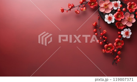 Delicate pink and white cherry blossoms on a solid red background with copy space. Chinese New Year 119807371